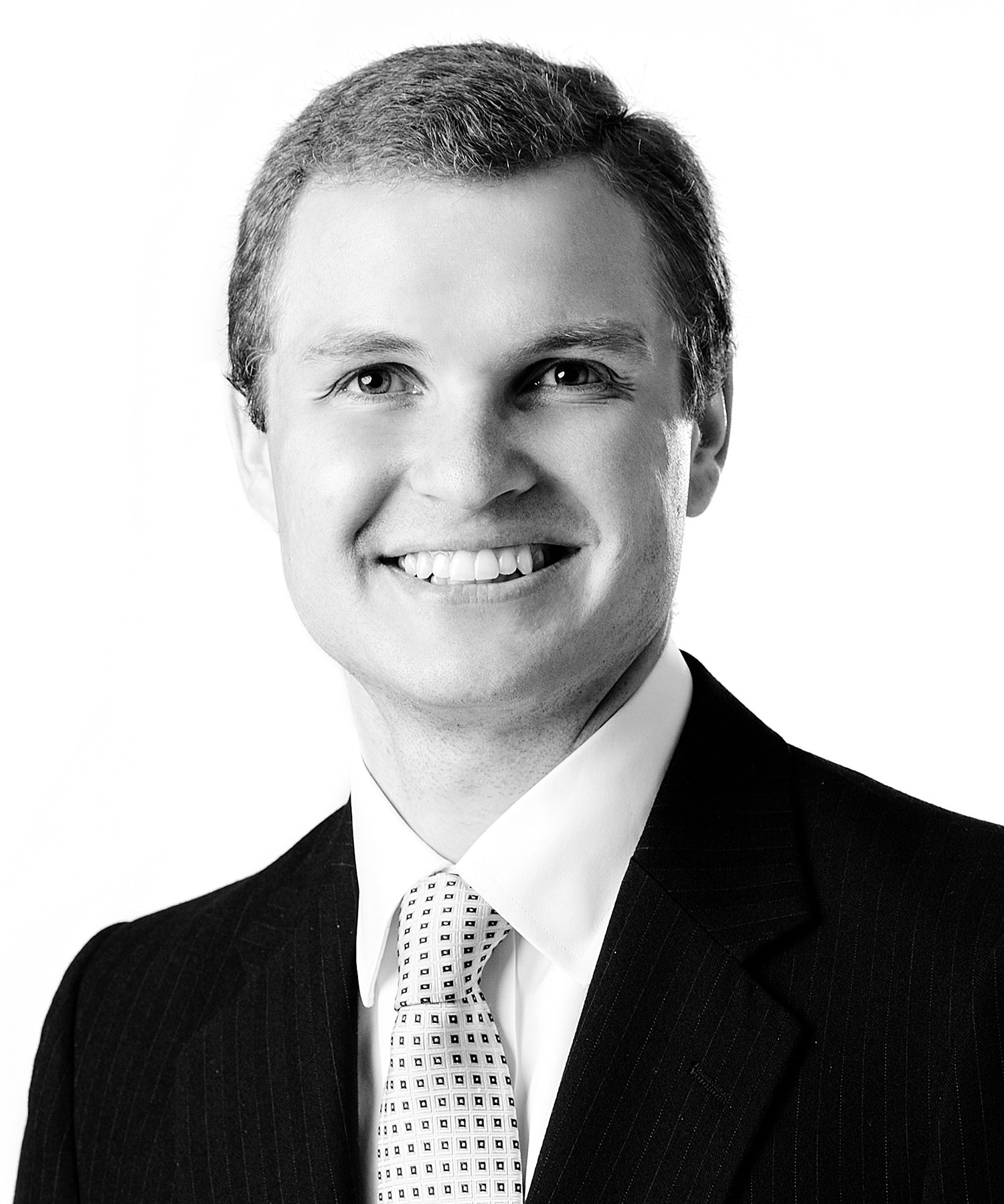 Brandon Baker, CPA, Senior Wealth Manager at Sage Financial Group. Headshot photograph of Brandon Baker, CPA smiling and looking directly at the camera, wearing professional attire.