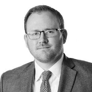 Joseph M. Gallagher, CFA, Senior Investment Officer at Sage Financial Group. Headshot photograph of Joseph M. Gallagher, CFA smiling and looking directly at the camera, wearing professional attire.