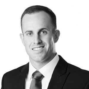 Daniel Hochbaum, CFA, Senior Investment Analyst at Sage Financial Group. Headshot photograph of Daniel Hochbaum, CFA smiling and looking directly at the camera, wearing professional attire.