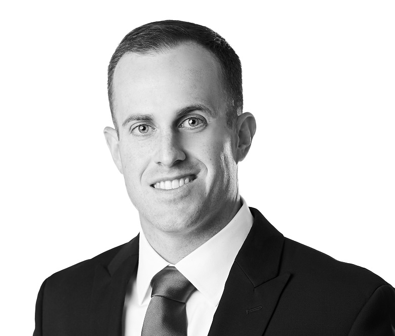 Daniel Hochbaum, CFA, Senior Investment Analyst at Sage Financial Group. Headshot photograph of Daniel Hochbaum, CFA smiling and looking directly at the camera, wearing professional attire.